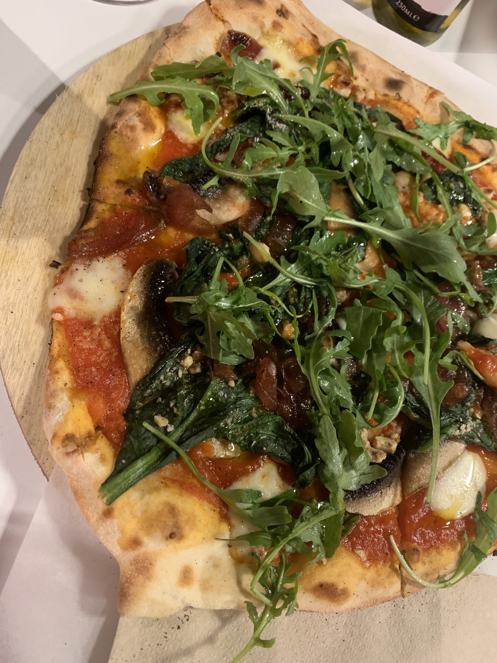 Spinach, mushrooms, caramelised onions, hazelnuts, rocket pizza